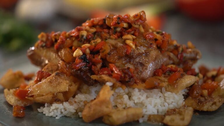 Roast duck with garlic rice, roasted peppers and nuts